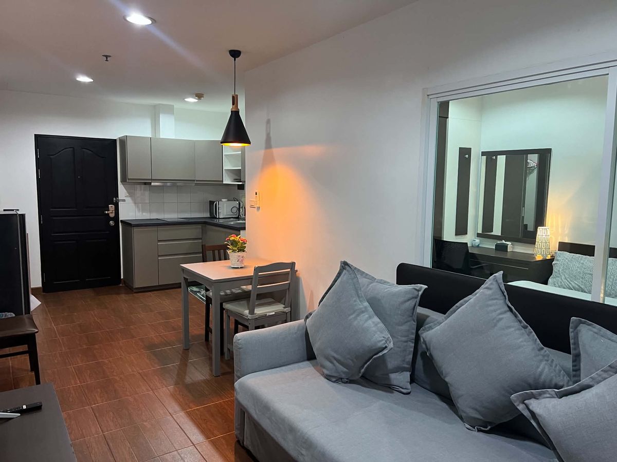 Sofa bed, dining table and kitchen